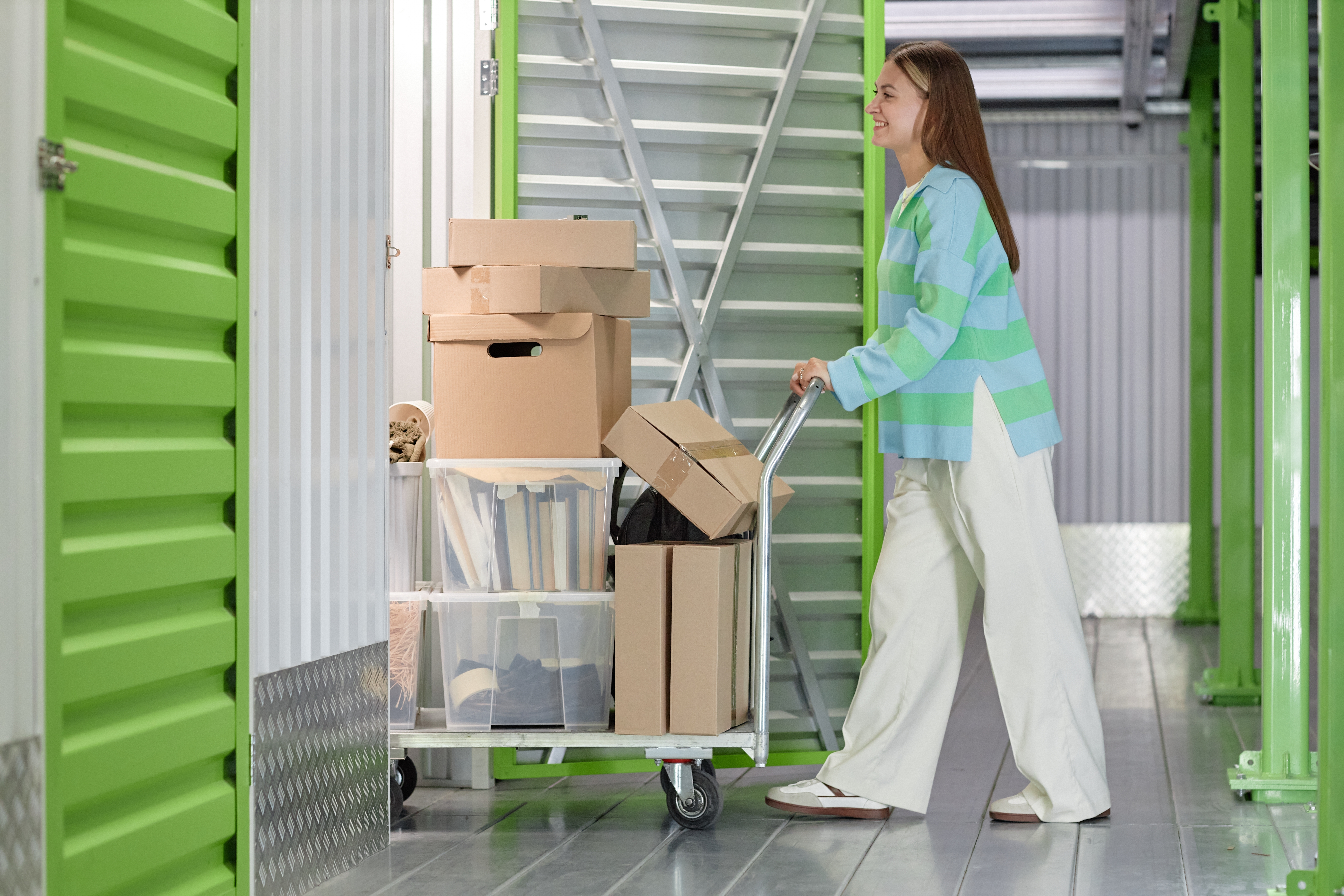 Woman loading items into a climate-controlled storage unit